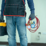 Technician checking AC