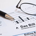 gas bill with a pen